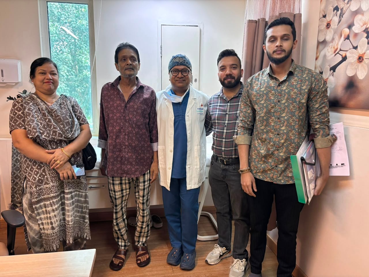 Mr. Muhitur Rahman with Dr. Vikas Jain and family at Manipal Hospital Dwarka after successful kidney tumor surgery