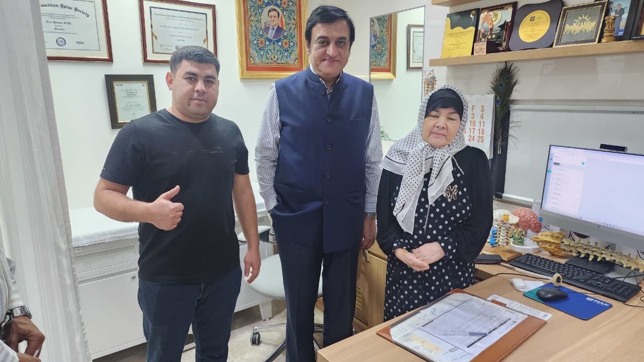 Uzbekistan schoolteacher patient with son and Dr. Arun Saroha at Max Hospital Dwarka — brain tumor removal success